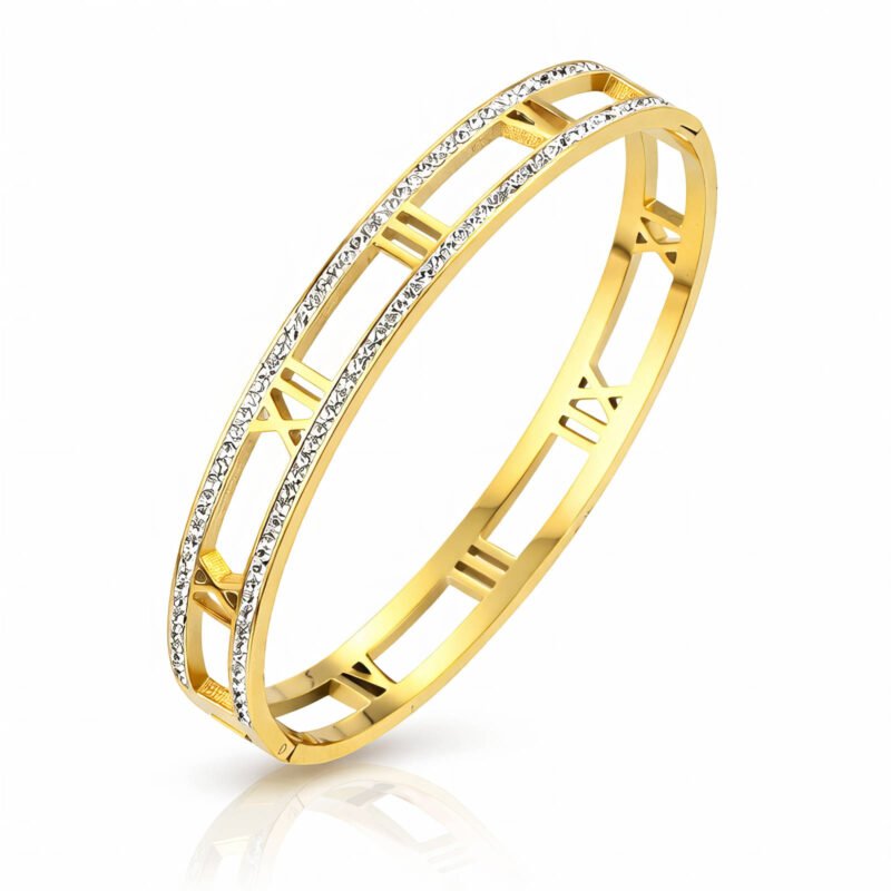 Gold cuff bracelet with Roman numeral cutouts and cubic zirconia accents