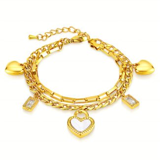 Gold plated bracelet with heart and cubic zirconia charms on a white background