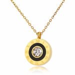 18k gold necklace with round Roman numeral pendant, black enamel detail, and crystal center