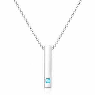 A minimalist necklace featuring a vertical bar pendant with a turquoise stone set near the base, on a delicate metal chain.
